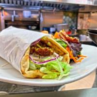 Falafel · Lettuce, tomato, onions, tahini sauce on pita bread with french fries or our side salad.
