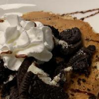 Oreo Cookie Pancakes · Three pancakes mixed with crumbled oreo cookies and topped with crumbled OREO cookies and wh...
