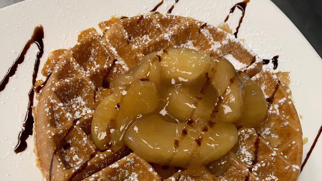 Apple Caramel Waffle · Filled with apples and caramel bites. Topped with apples and powdered sugar, drizzled with chocolate.