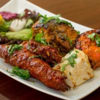 Combination Platter · Chicken malai kebab, chicken tikka, barrah kebab and fish tikka.