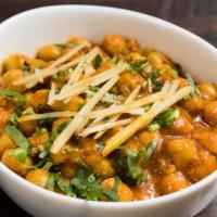 Chana Masala · Chickpeas are slow cooked in a gravy of onions, tomato and a special house spice.