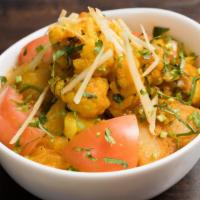 Aloo Gobi · Potatoes and cauliflower with cumin and spices.