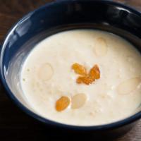 Rice Pudding · Candied almonds, cinnamon and golden raisins.