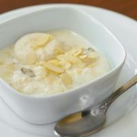 Rasmali · Cottage cheese cooked with cream and almond sauce.