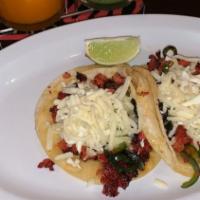 Tacos -El Diablito (Spicy Pork) · Corn tortilla, with spicy chorizo and poblano pepper  topped with red salsa and cheese.