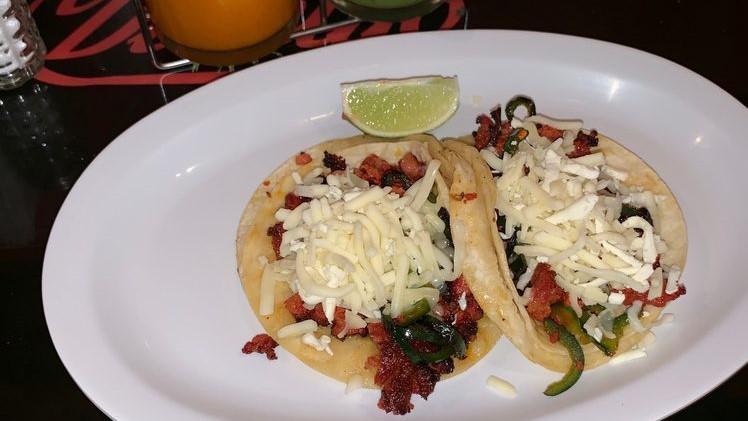 Tacos -El Diablito (Spicy Pork) · Corn tortilla, with spicy chorizo and poblano pepper  topped with red salsa and cheese.