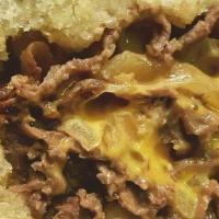 Philly Cheese Steak · Hot grilled beef steak, melted cheese, grilled onions, on garlic bread.