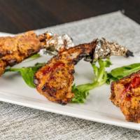 Lamb Chops - 4 Pieces · Tender Juicy lamb chop , coated with spices, Dijon Mustard, dressed in chef's special marina...