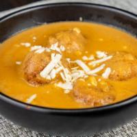Malai Kofta · Spongy Cottage Cheese Mashed with cashew nuts, raisin, rolled into balls and cooked in a mil...