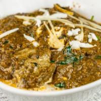 Palak Paneer · Chunks of Homemade Paneer (Cottage Cheese) in thick creamy spinach gravy seasoned with garli...