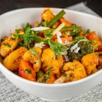 Veg Jalfrezi · Assorted vegetables sautéed with diced paneer, sweet peppers, red onions, tomatoes and exoti...