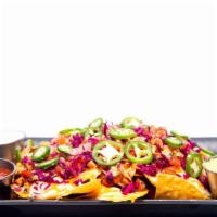 Tapchos · Fresh cut house chips smothered with grilled bbq chicken. Jalapenos, shaved lettuce. Pico de...