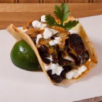 Beans & Brussels · roasted brussel sprouts, black beans, Tony's spicy red sauce, sour cream
