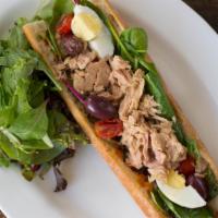 Mediterranean Tuna · Organic egg, mesclun greens, tomatoes, black olives, harissa spread on a french baguette.