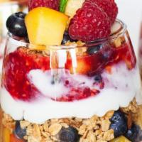 Greek Yogurt Parfait · Fat free yogurt, fresh mix berries, granola, honey, flavor of the week, strawberry, blueberr...