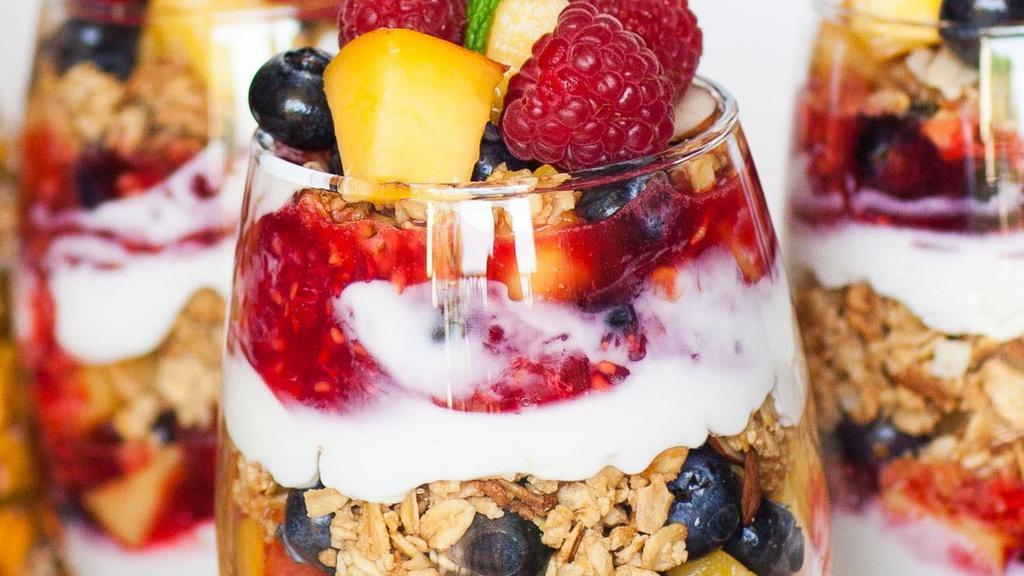 Greek Yogurt Parfait · Fat free yogurt, fresh mix berries, granola, honey, flavor of the week, strawberry, blueberry, orange, peach.