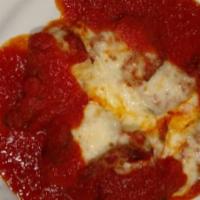 Meatball Parmigiana · Pomodoro sauce and melted mozzarella cheese.