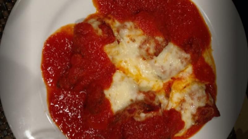 Meatball Parmigiana · Pomodoro sauce and melted mozzarella cheese.