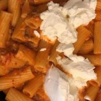 Rigatoni Bolognese · Southern Italian style fresh hearty meat sauce , served with a touch of cream, served over r...