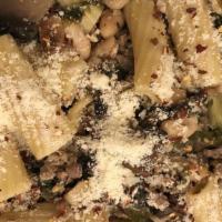 Rigatoni Campania · Fresh escarole, crumbled  Italian style sausage and a touch of cannellini beans sauteed in a...