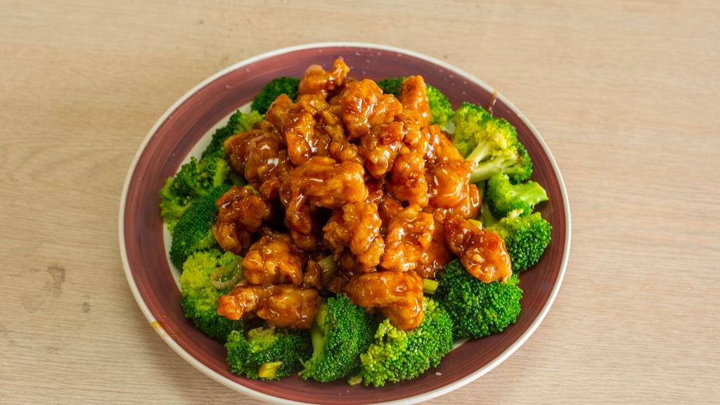 General Tso'S Chicken · Chunk of tender chicken meat, slightly fried and breaded, cooked with brown spicy sauce and circled with steamed broccoli. With white rice. Hot and spicy.