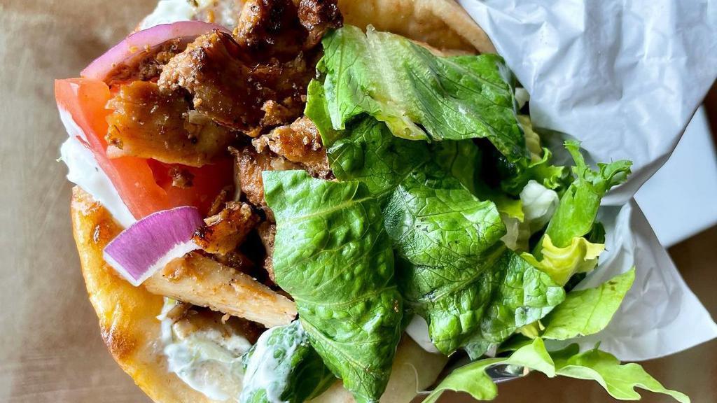 Marinated Chicken Gyro · Served in a warm pita with lettuce, tomatoes, red onions, and tzatziki sauce.
