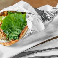 Chicken Souvlaki · Served in a warm pita with lettuce, tomatoes, red onions, and tzatziki sauce.