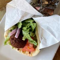 Falafel · Served in a warm pita with lettuce, tomatoes, red onions, and tahini sauce.