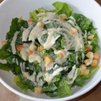 Caesar Salad · Romaine, Parmesan cheese, croutons, and classic creamy Caesar dressing.
