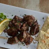 Lamb Sticks · Kebobs of meat, marinated and grilled. Served with pita.