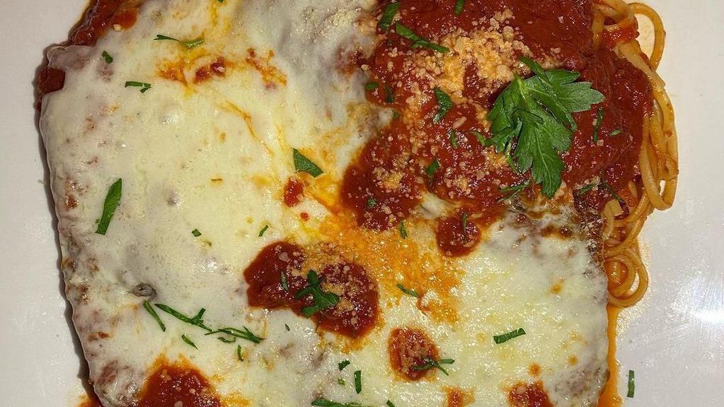 Lasagna · Ricotta, ground beef, mozzarella, and house-made marinara.