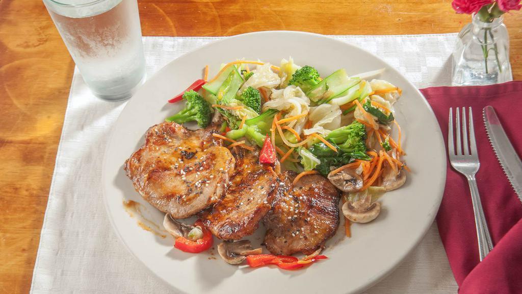 Grilled Pork Chops · Marinated with Thai herb served with sautéed mixed vegetables.