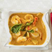 Red Curry · Spicy. Bamboo shoot, zucchini, bell pepper, basil, and coconut milk in red curry.