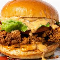 Cajun Chicken Sandwich · Crispy Cajun Chicken, Lettuce, Tomatoes ,Remoulade Sauce with Brioche Bun. Server  with Choi...