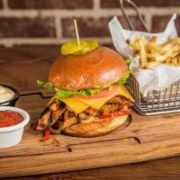 Sriracha Spicy Chicken Burger · Sauteed sriracha chicken, American cheese, caramelized onions, bell peppers, Green Leaf, tom...