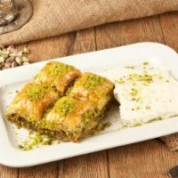 Baklava - 4 Pieces · 4 pieces mini baklava Sweet pastry made of extremely thin sheets of fillo dough layered with...