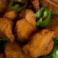 Salt & Pepper Chicken Tenders · Crispy soy chicken lightly seasoned served with vidatto onion vinaigrette.