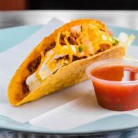 Chili Taco · Ground beef. Served with fresh lettuce, tomato, cheddar cheese, and sour cream.