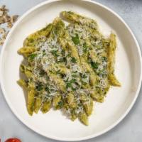 Pasta Manipesto · Fresh basil leaves, garlic, grated parmesan cooked with penne. Served with bread.
