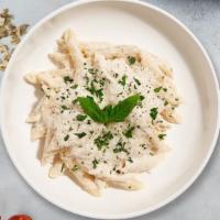 All About Alfredo · Penne pasta cooked in creamy white sauce and aged parmesan. Served with bread.