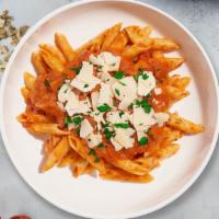 Tipsy Pasta · Creamy tomato and white sauce blend cooked with penne. Served with bread.