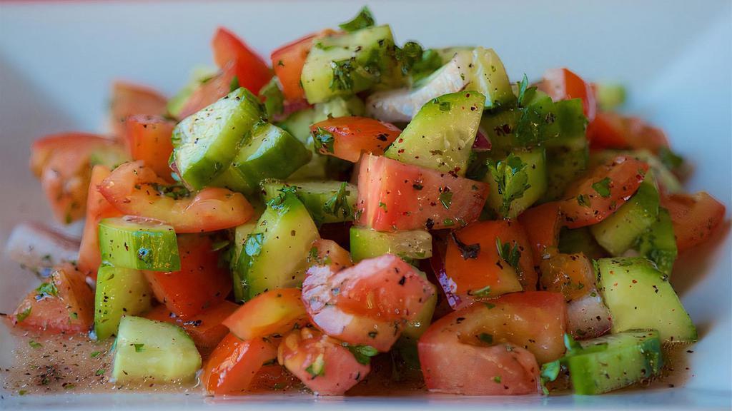 Armenian Salad · Ripe tomatoes, cucumbers, onions, and our own herbs and spices from Armenia.