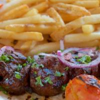 Pork Kebab  · Served with grilled vegetables, rice and pita bread.