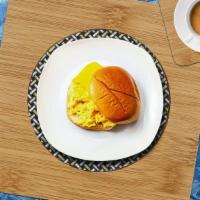 Two Eggs W/ Cheese On A Hero · Scrambled egg, cheddar cheese, served on a hero.