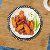 Chicken Wings · 12 pcs Fresh chicken wings breaded and fried until golden brown. Served with a side of ranch...