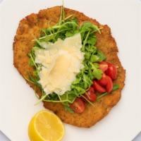Chicken Milanese · Organic airline chicken topped with arugula, cherry tomatoes and shaved Parmigiano.