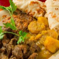 Curry Goat · Served with one side and your choice of rice.