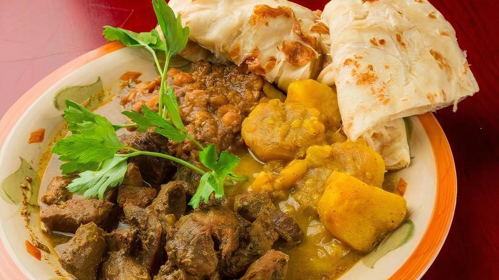 Curry Goat · Served with one side and your choice of rice.