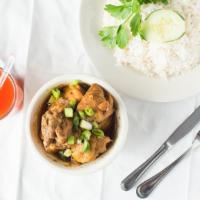 Curry Chicken · Served with one side and your choice of rice.