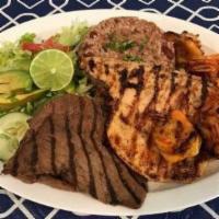 Mar Y Tierra · Sea and ground. Grilled marinated shrimp, steak, and chicken served with tomato chimol And y...